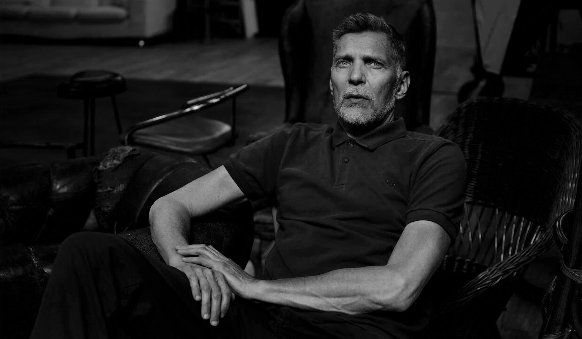 Portrait of the Dutch photographer Erwin Olaf in high-contrast black and white.